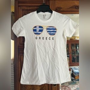 Tee-shirt purchased in Santorini, Greece. Washed once and too small. Never worn